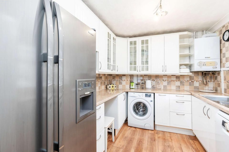 Kitchen or kitchenette, dishwasher, oven, stove, washing machine, dryer