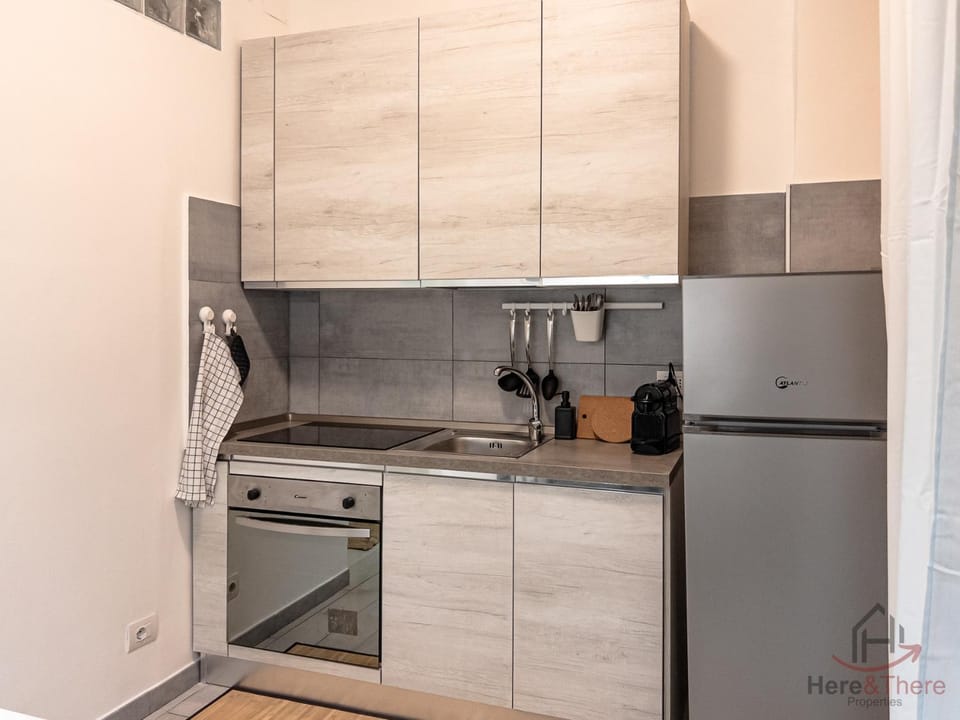 Kitchen or kitchenette, dishwasher, oven, stove