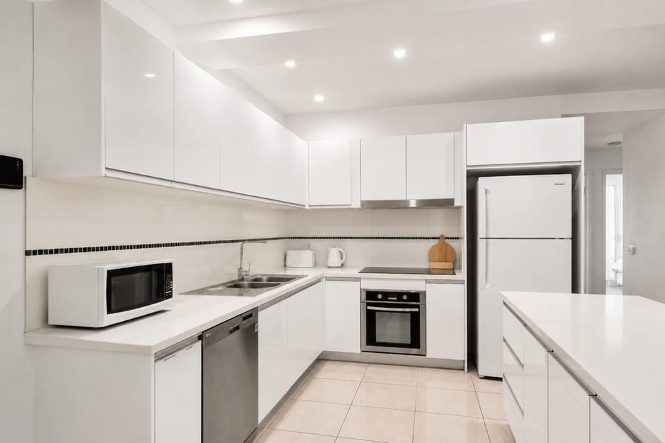 Kitchen or kitchenette, dishwasher, microwave, oven, stove