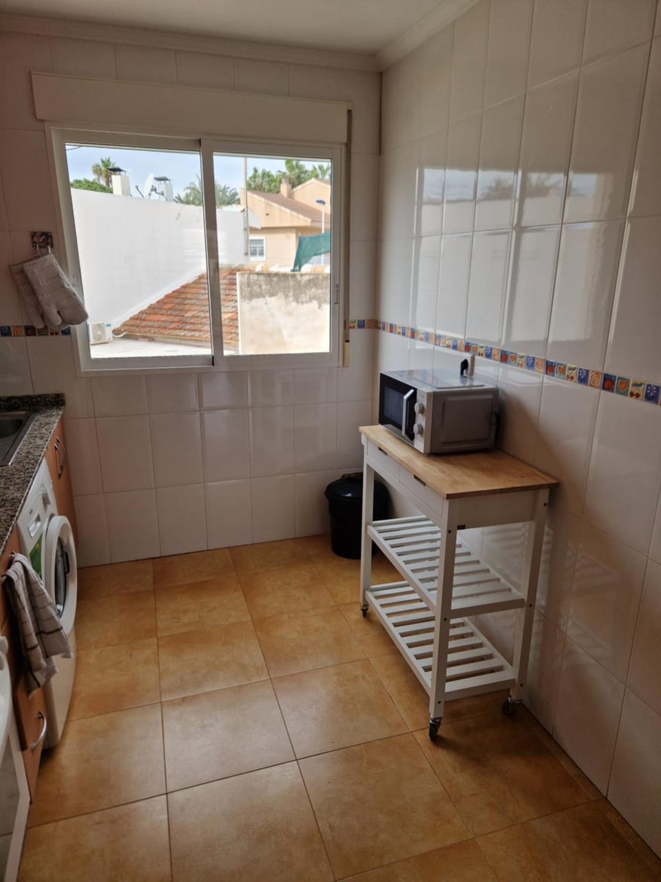 Kitchen or kitchenette, microwave, oven, toaster