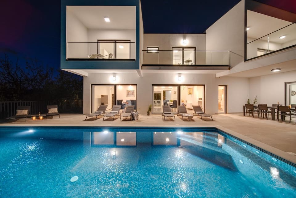Property building, Patio, Night, Pool view, Swimming pool, sunbed