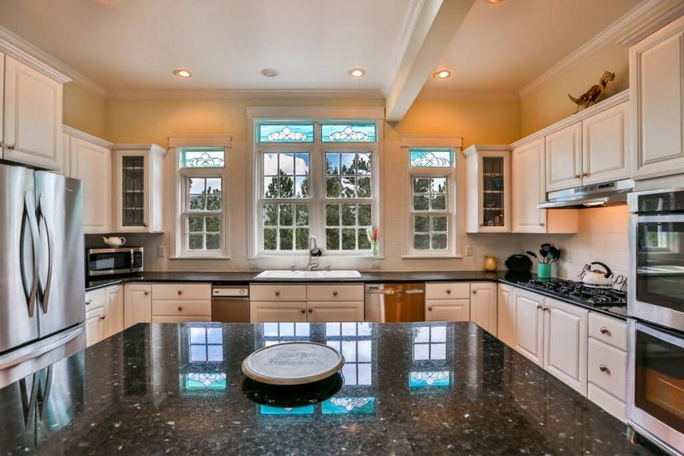 Kitchen or kitchenette, dishwasher, oven, stove