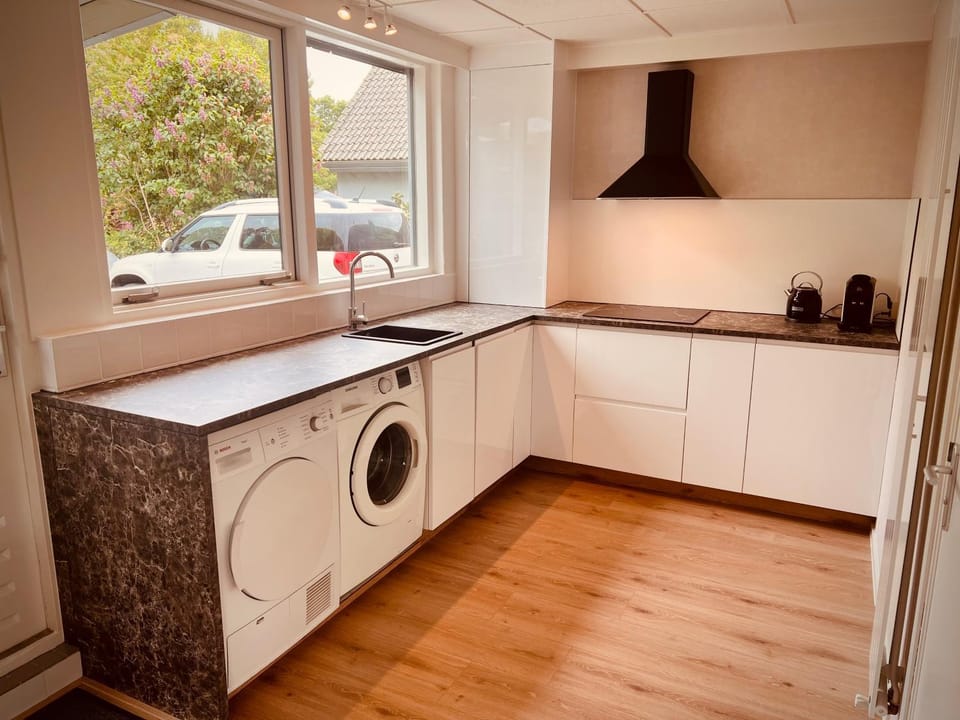 Kitchen or kitchenette, dishwasher, stove, washing machine, dryer