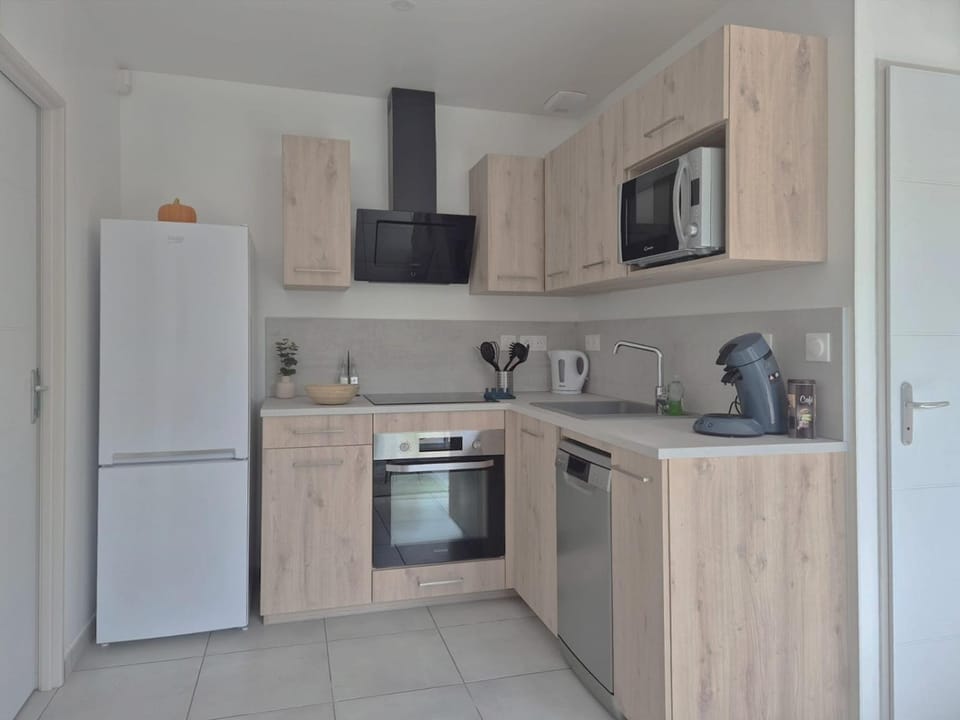 Kitchen or kitchenette, dishwasher, oven, stove, toaster