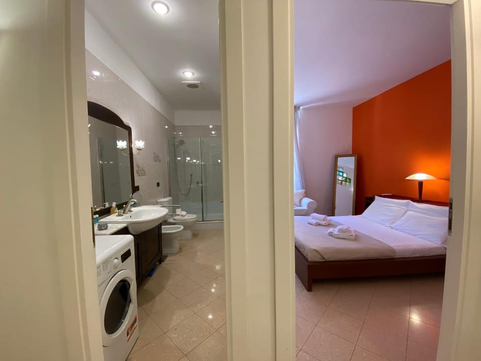 Shower, Bed, Bathroom, Photo of the whole room, Bedroom, towels, washing machine, dryer