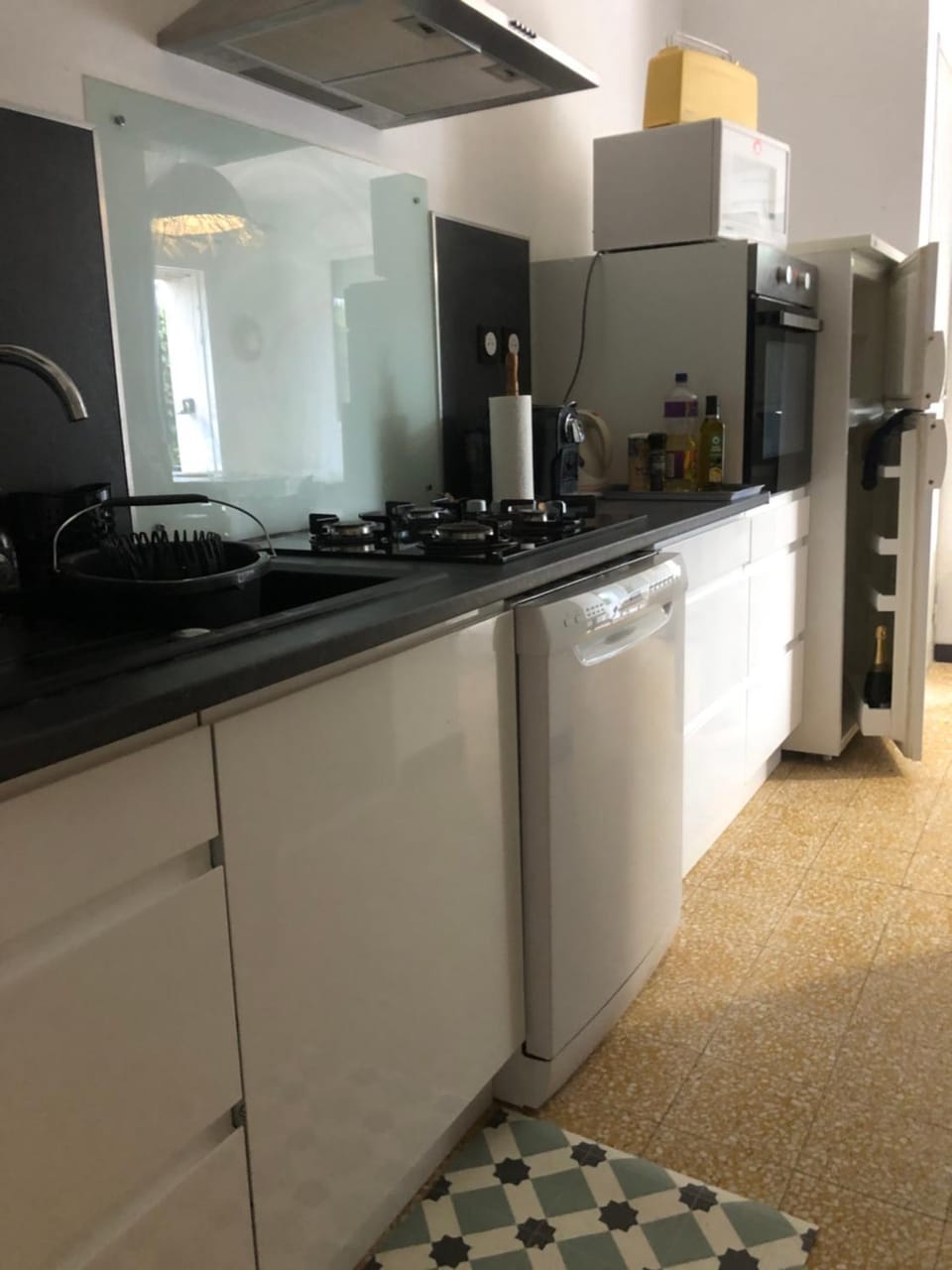 Kitchen or kitchenette, dishwasher, oven, stove, toaster