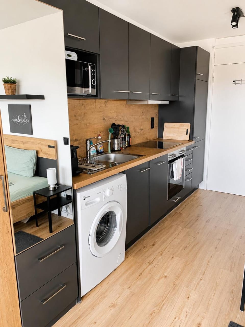 Kitchen or kitchenette, dishwasher, oven, stove