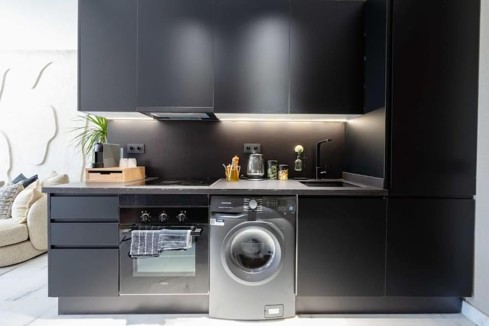 Kitchen or kitchenette, oven, stove, washing machine, dryer