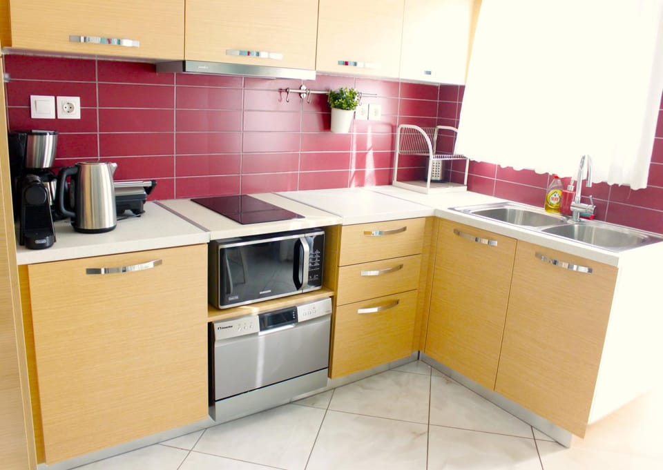 Kitchen or kitchenette, dishwasher, microwave, stove