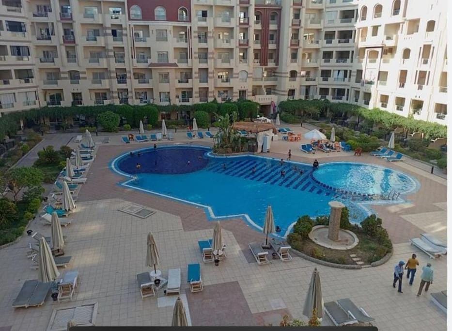 Property building, Pool view, Swimming pool, sunbed