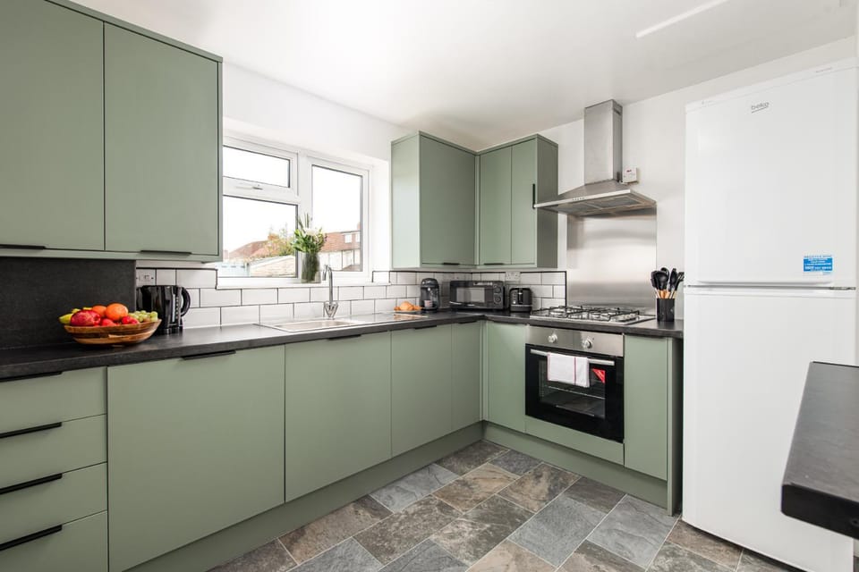 Kitchen or kitchenette, dishwasher, oven, stove, toaster