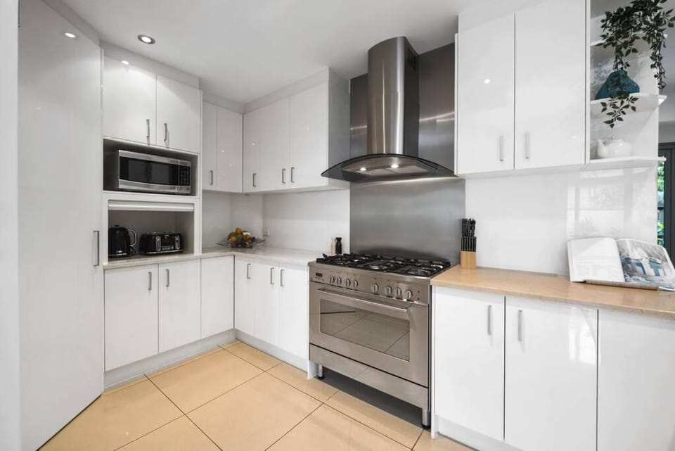 Kitchen or kitchenette, dishwasher, oven, stove, toaster