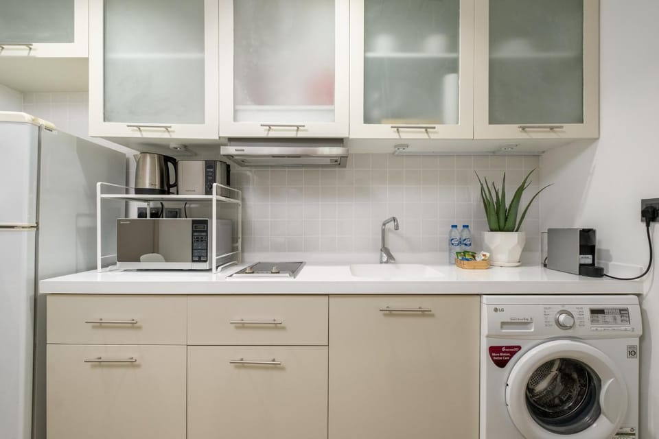 Kitchen or kitchenette, toaster, washing machine