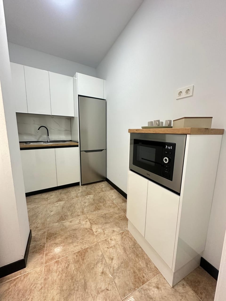 Kitchen or kitchenette, dishwasher, oven, stove