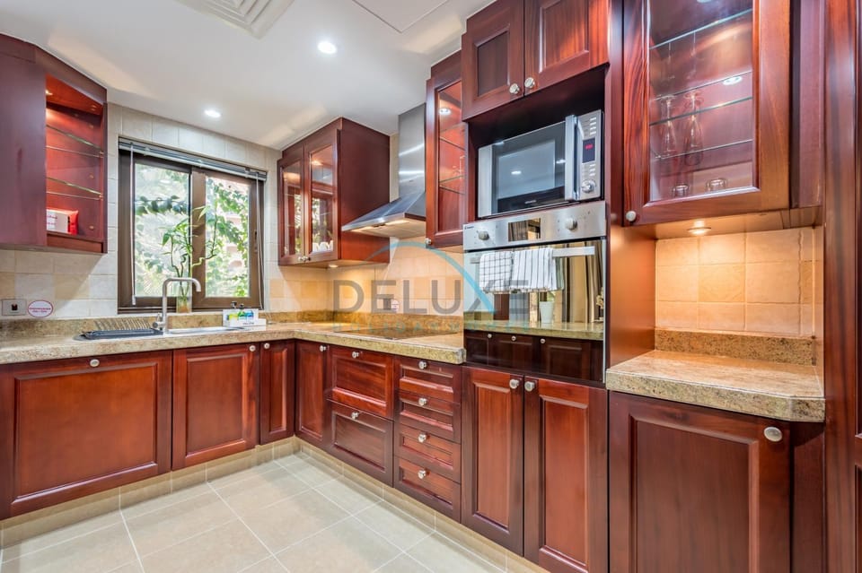 Kitchen or kitchenette, dishwasher, microwave, oven, stove