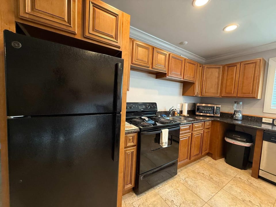 Kitchen or kitchenette, dishwasher, oven, stove, toaster