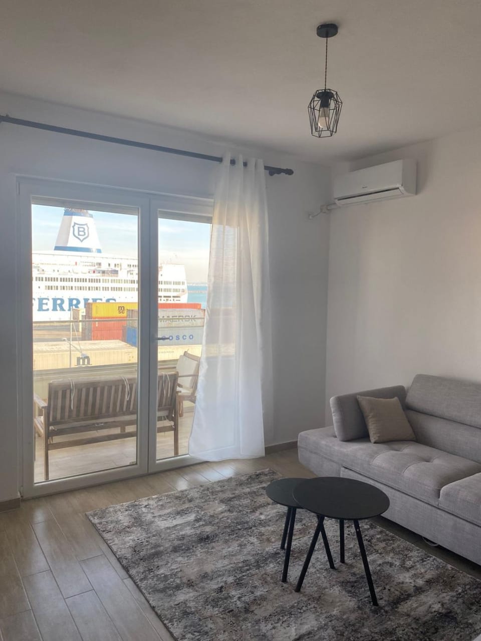 View (from property/room), Balcony/Terrace, Living room, Seating area, air conditioner
