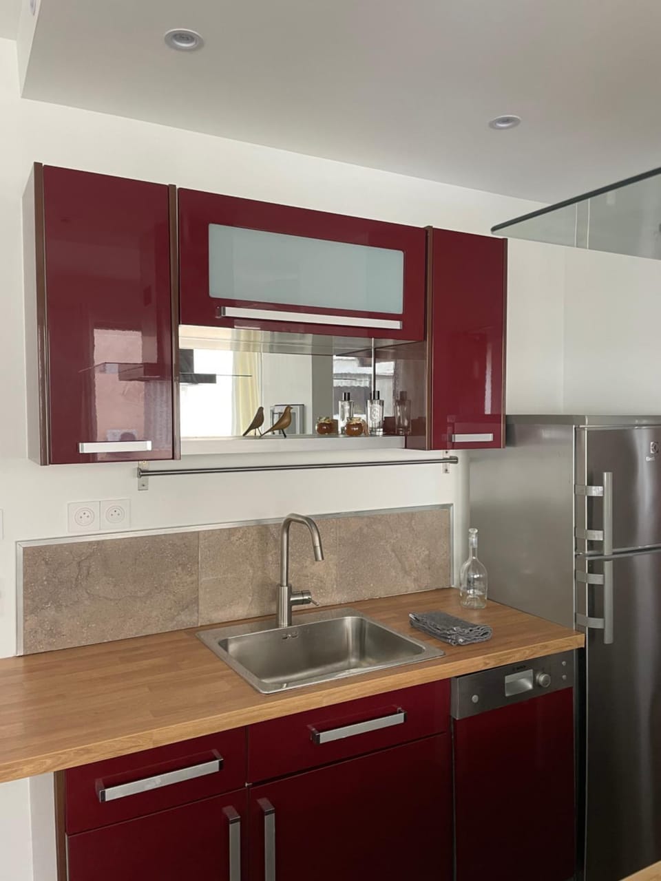 Kitchen or kitchenette, dishwasher, oven, stove