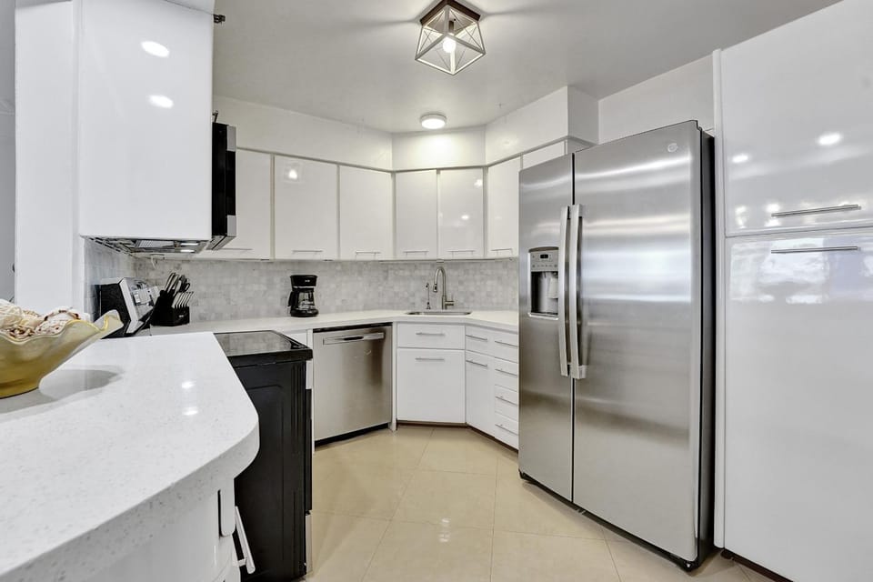 Kitchen or kitchenette, dishwasher, oven, stove