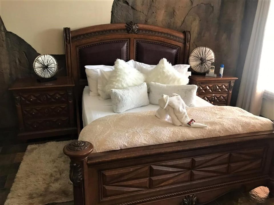 Bed, Bedroom, hair dryier, towels, air conditioner
