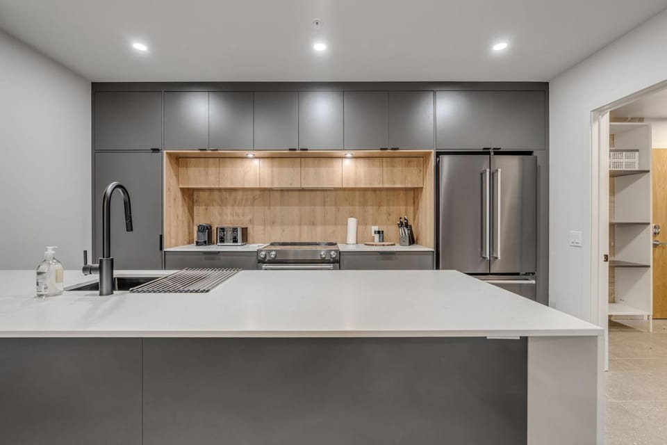 Kitchen or kitchenette, dishwasher, oven, stove