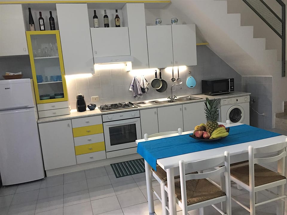 Kitchen or kitchenette, Dining area, microwave, oven, stove, washing machine, kitchen