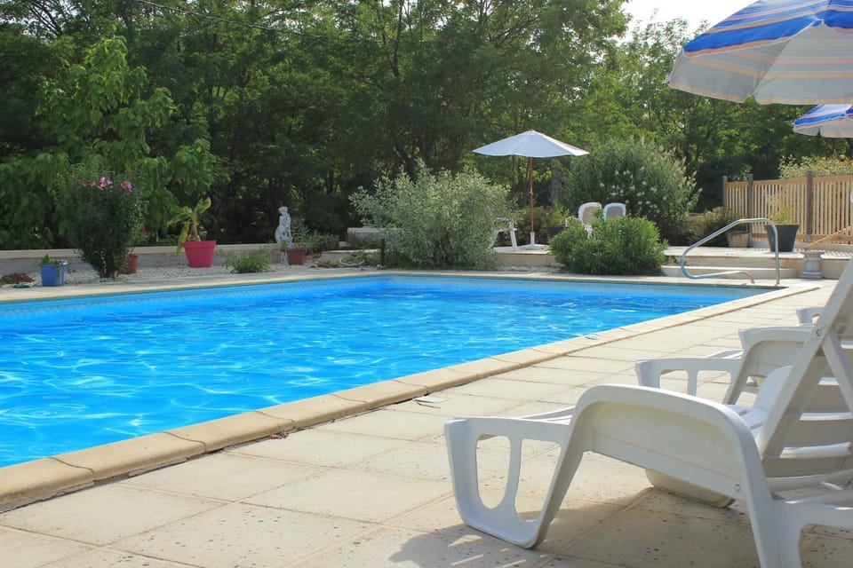 Property building, Patio, Pool view, Swimming pool, sunbed
