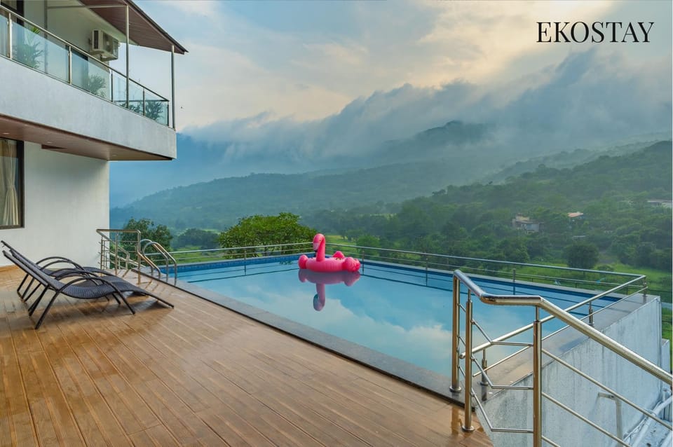 Nearby landmark, Day, Natural landscape, View (from property/room), Balcony/Terrace, Evening entertainment, Text overlay, Mountain view, Pool view, Swimming pool, sunbed