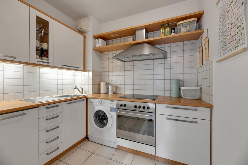 Kitchen or kitchenette, dishwasher, oven, stove, washing machine