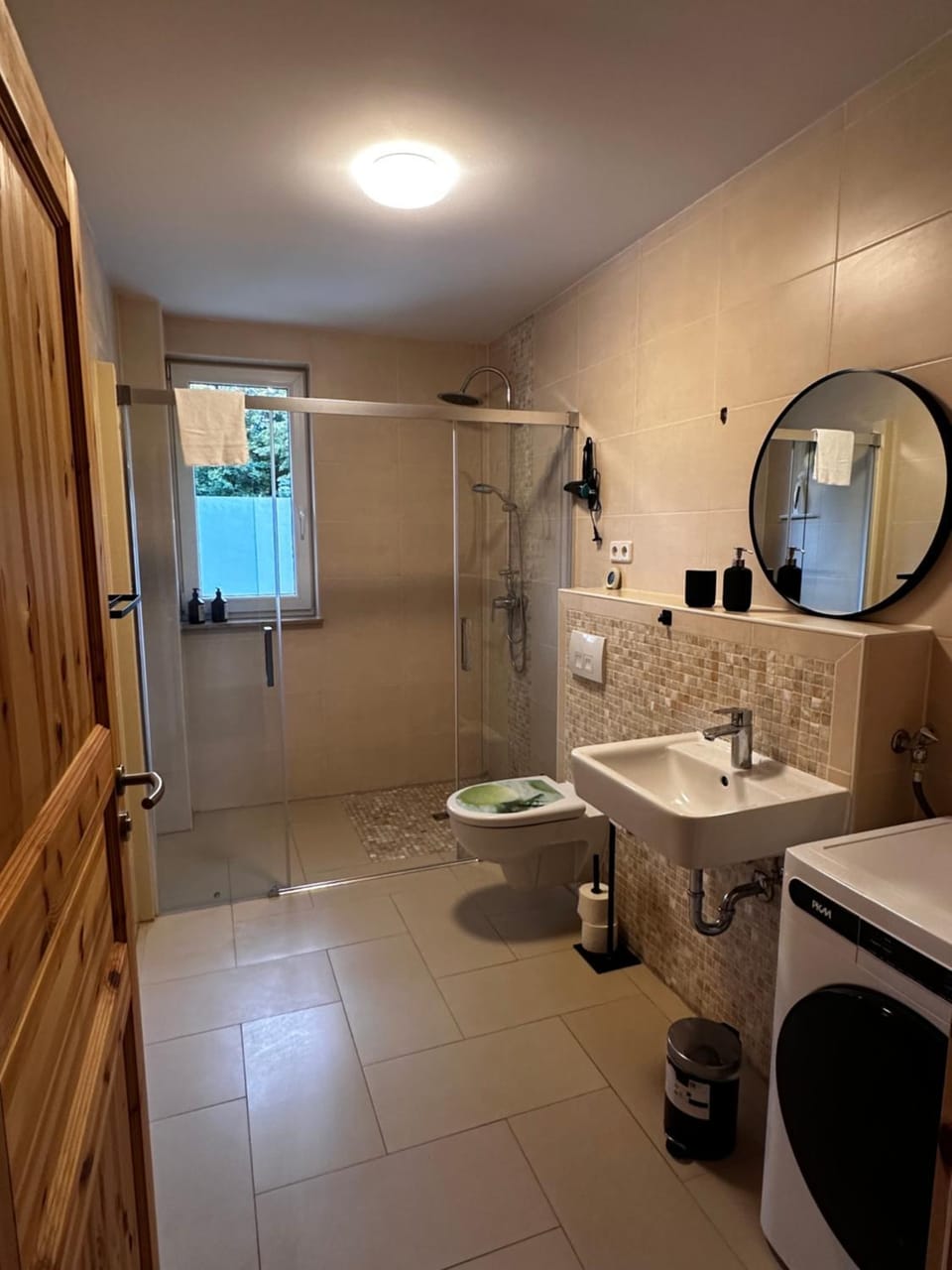 Bathroom, hair dryier, towels, towels, washing machine, washing machine