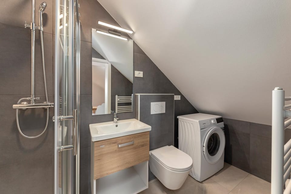 Shower, Toilet, Bathroom, towels, washing machine, dryer