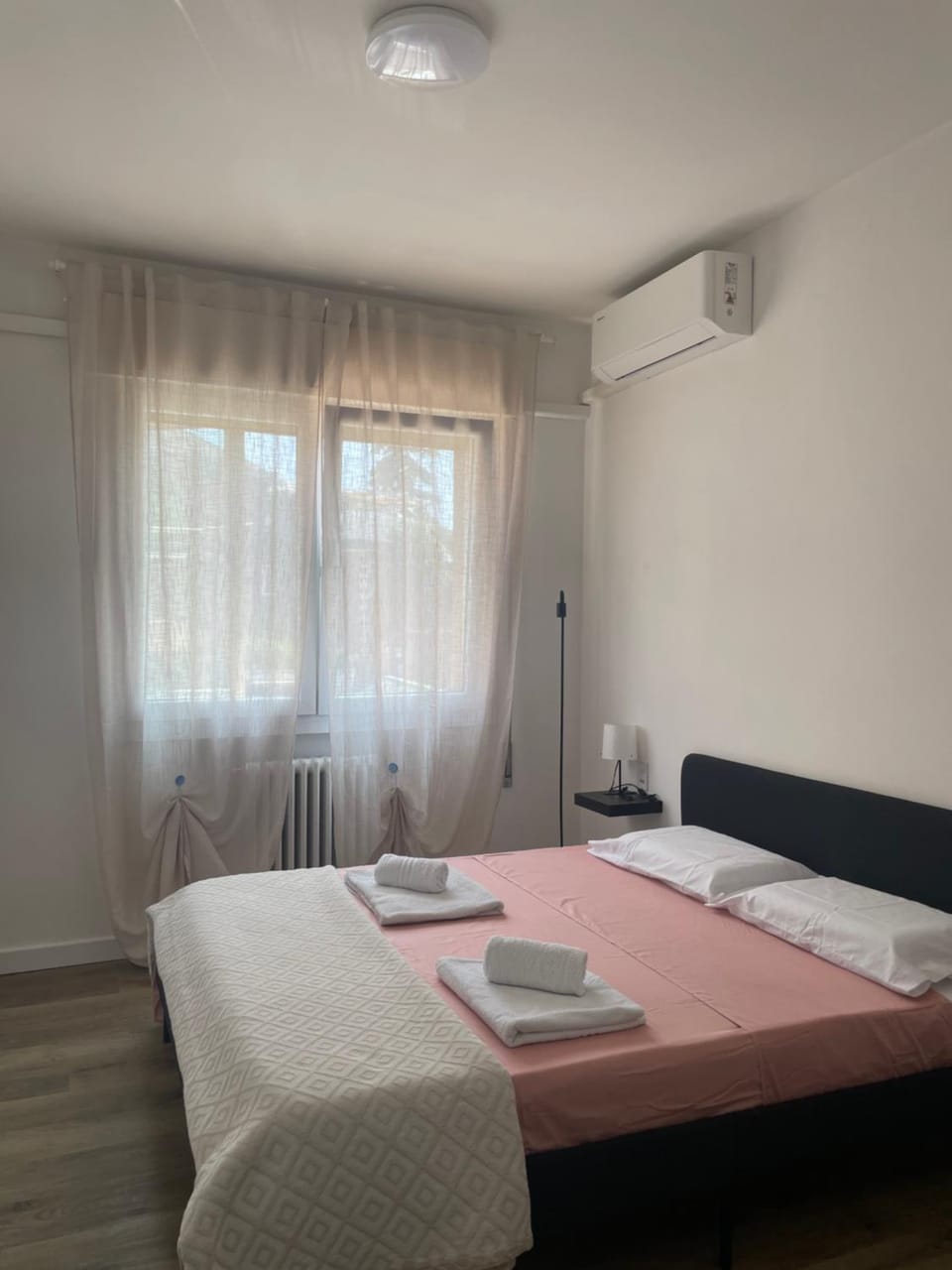 Bed, Photo of the whole room, Bedroom, towels, air conditioner