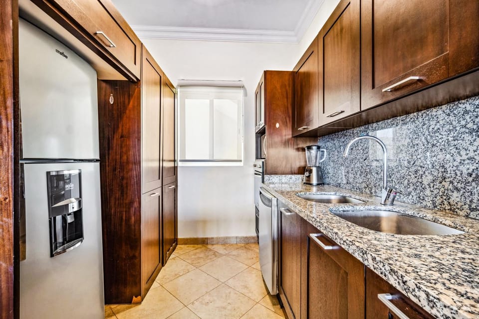 Kitchen or kitchenette, dishwasher, oven, stove