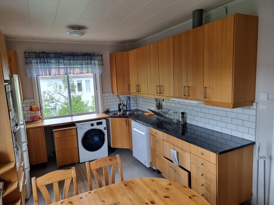 Kitchen or kitchenette, dishwasher, stove, washing machine, dryer