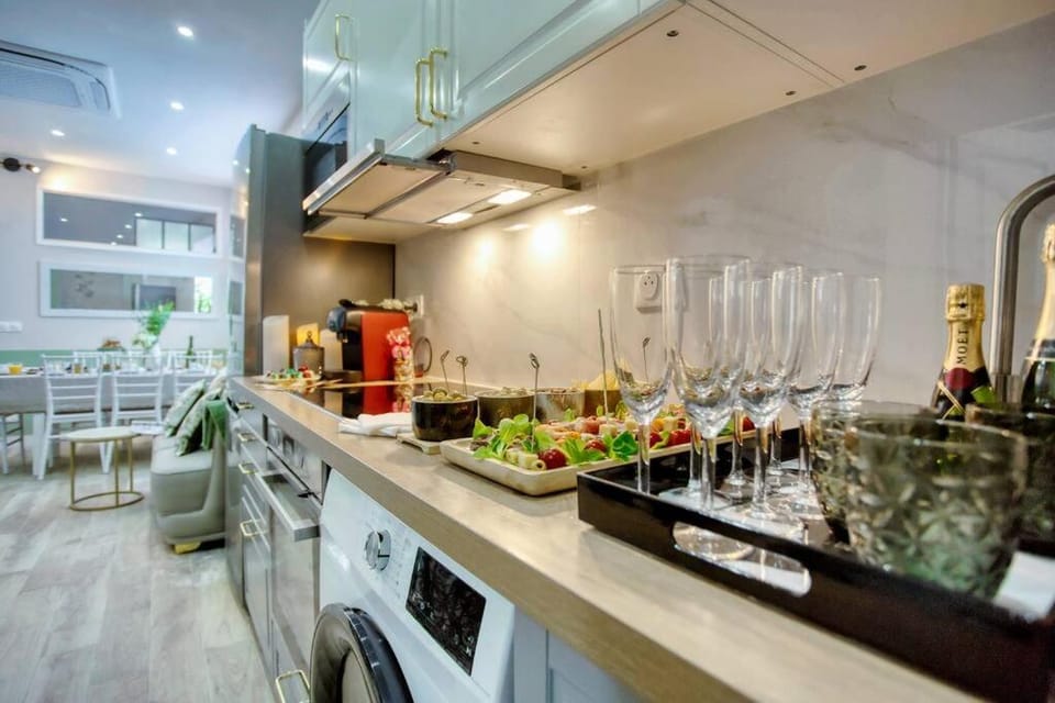 Kitchen or kitchenette, oven, stove, washing machine, dryer