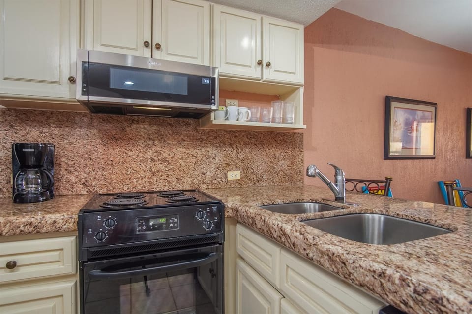 Kitchen or kitchenette, oven, stove