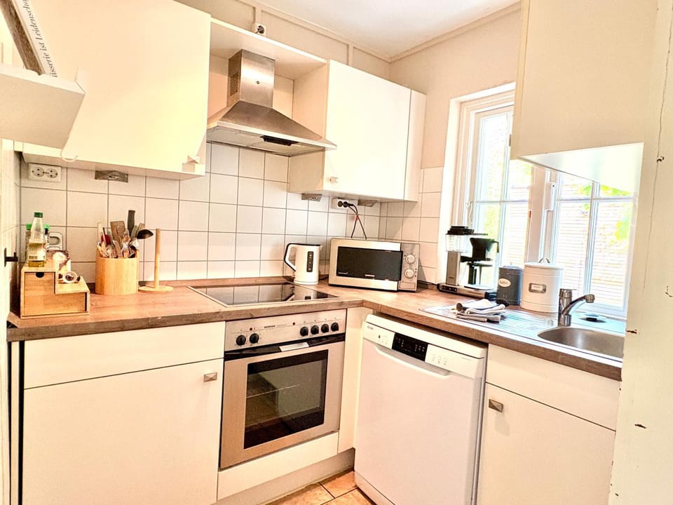Kitchen or kitchenette, dishwasher, oven, stove, toaster