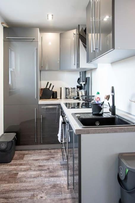 Kitchen or kitchenette, dishwasher, oven, stove