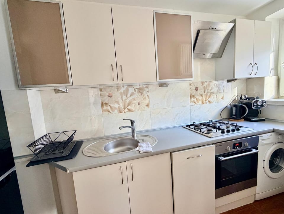 Kitchen or kitchenette, dishwasher, stove, toaster