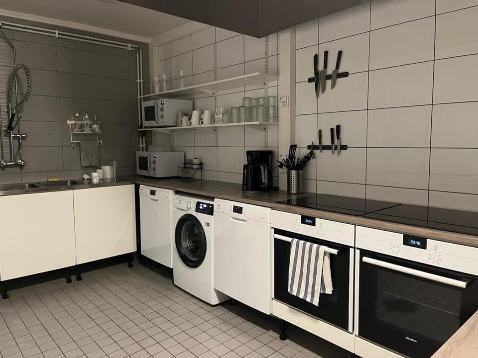 Kitchen or kitchenette, dishwasher, microwave, oven, stove, washing machine