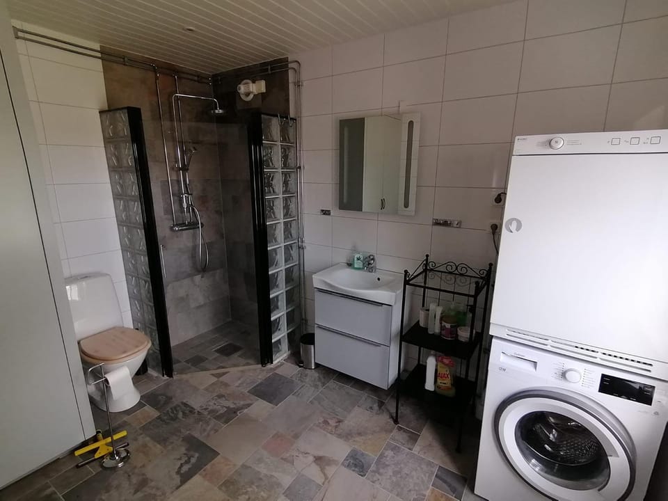 Shower, Toilet, Bathroom, towels, washing machine, dryer