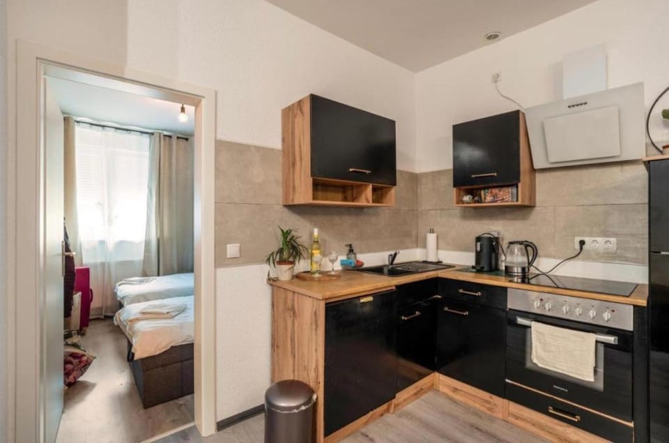 Kitchen or kitchenette, dishwasher, oven, stove