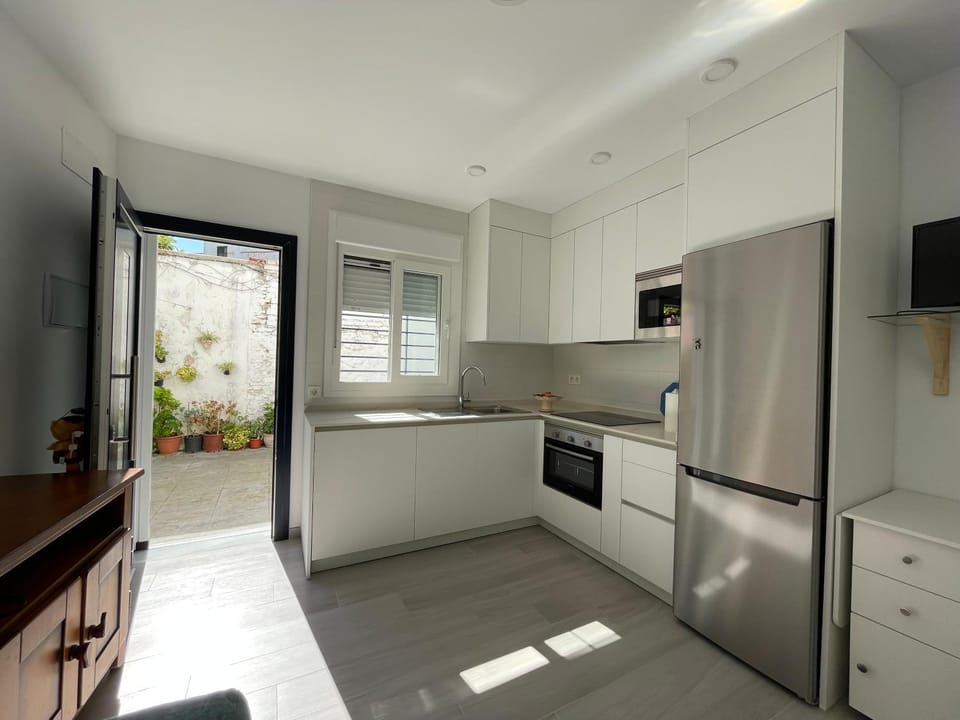 Kitchen or kitchenette, dishwasher, oven, stove