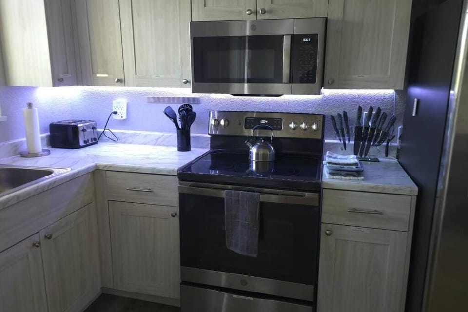 Kitchen or kitchenette, dishwasher, oven, stove, toaster