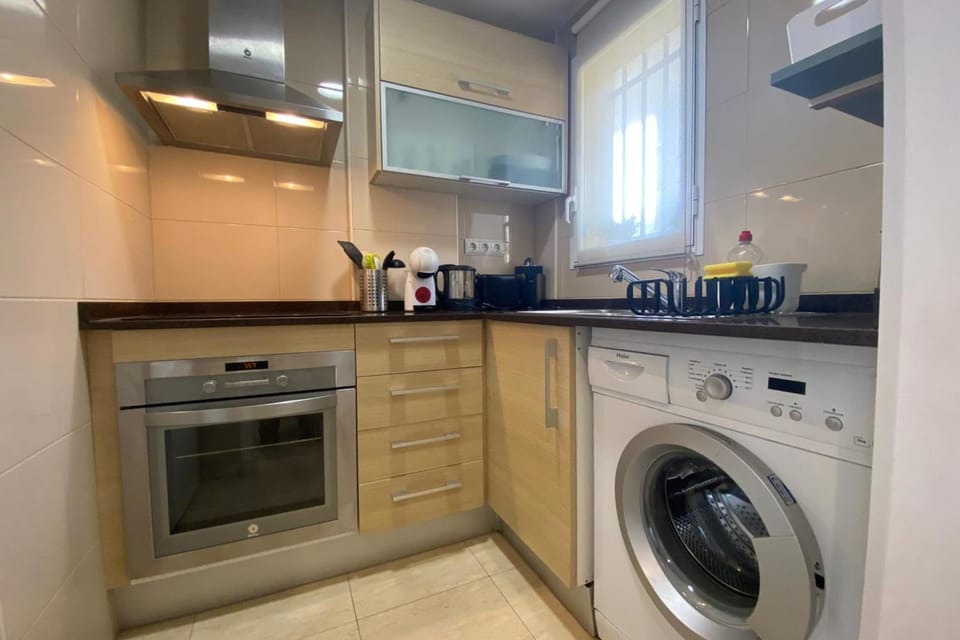 Kitchen or kitchenette, washing machine