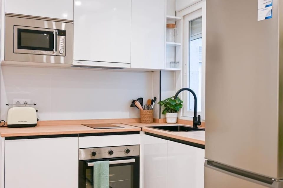Kitchen or kitchenette, dishwasher, oven, stove, toaster