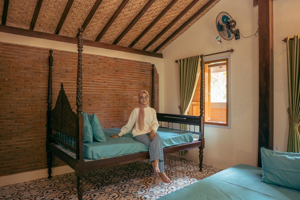 Bed, People, Living room, Seating area, Bedroom