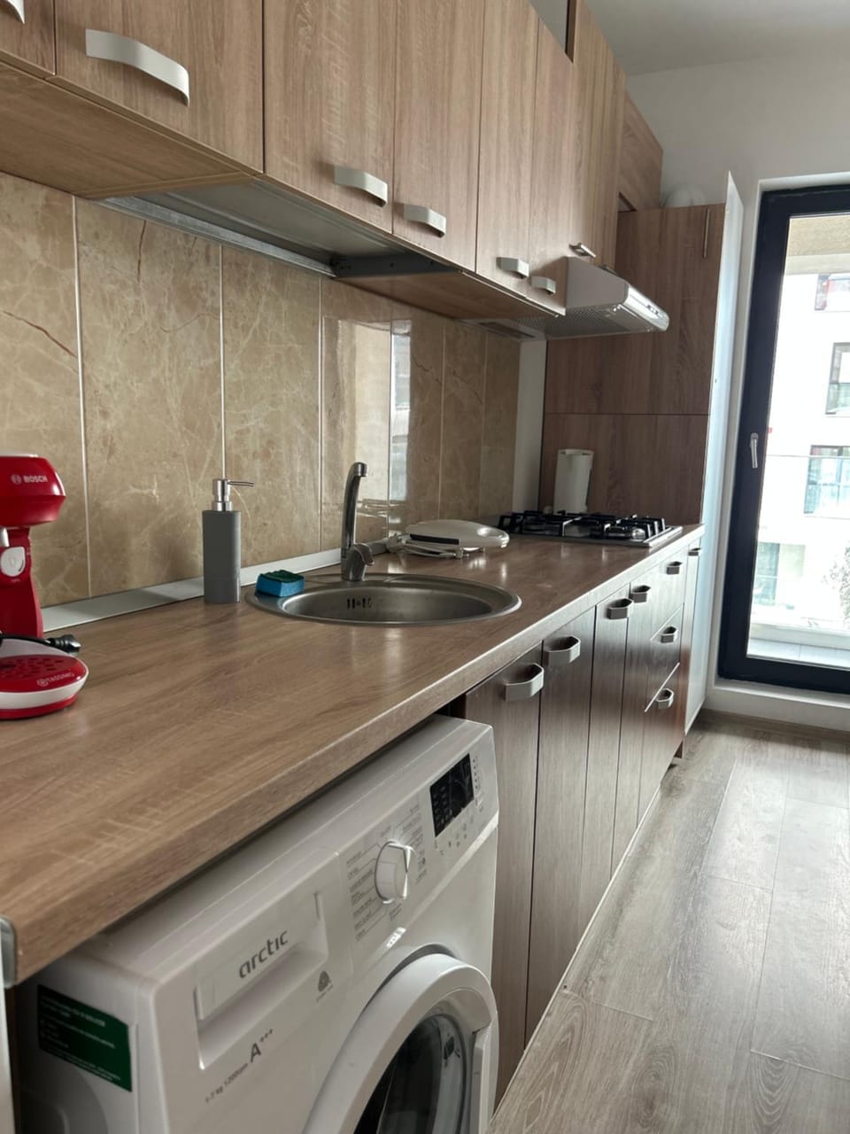 Kitchen or kitchenette, stove, washing machine