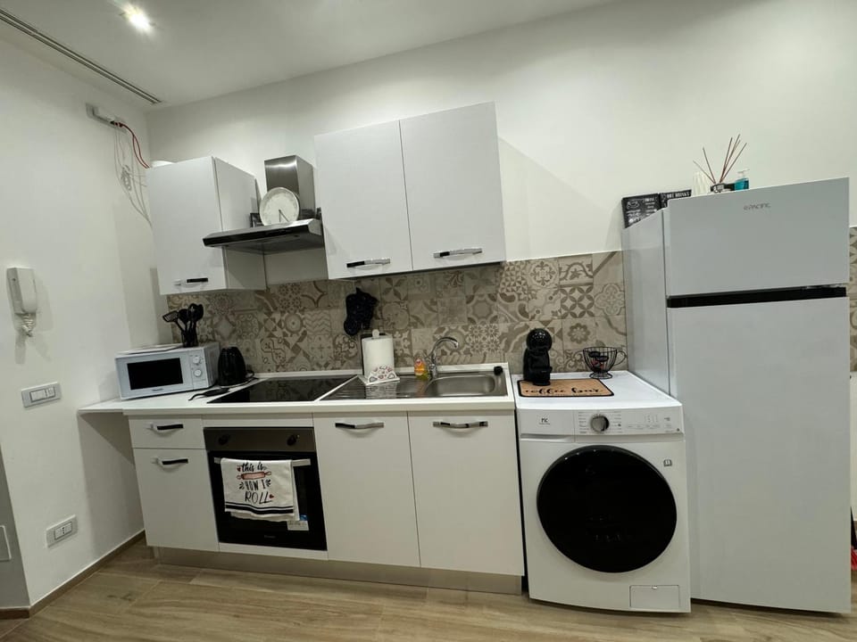 Kitchen or kitchenette, dishwasher, oven, stove, toaster, washing machine, dryer