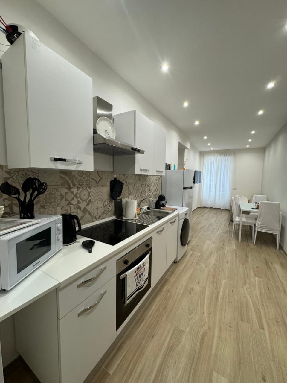 Kitchen or kitchenette, Dining area, dishwasher, oven, stove, washing machine, dryer